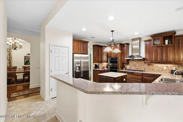 a living room with furniture fireplace and a large window