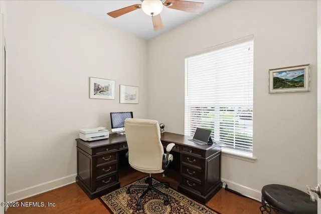 a bedroom with a bed and a table in it