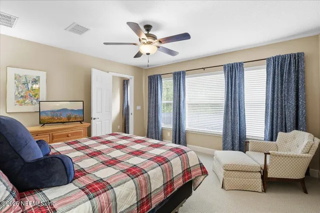 a patio with a table and chairs under an umbrella