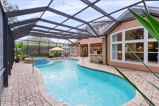 an aerial view of a house with a garden