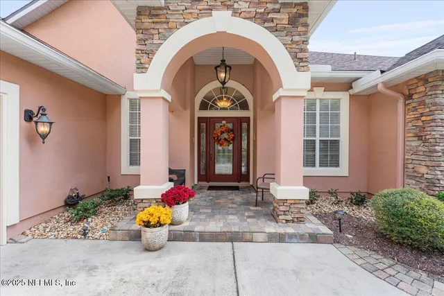 a living room with furniture and a piano