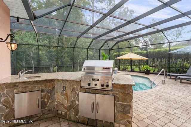 an aerial view of residential houses with outdoor space and swimming pool