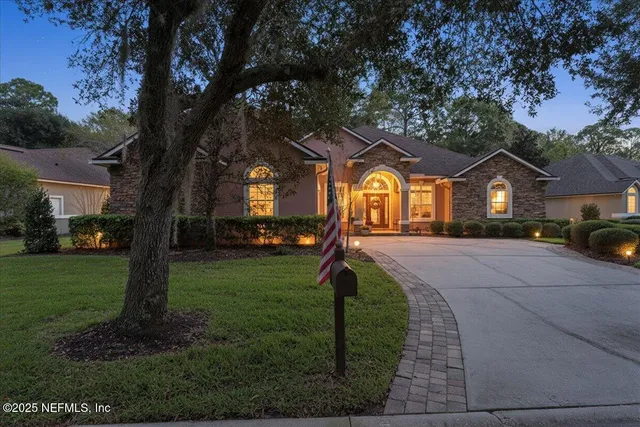 front view of a house with a garden