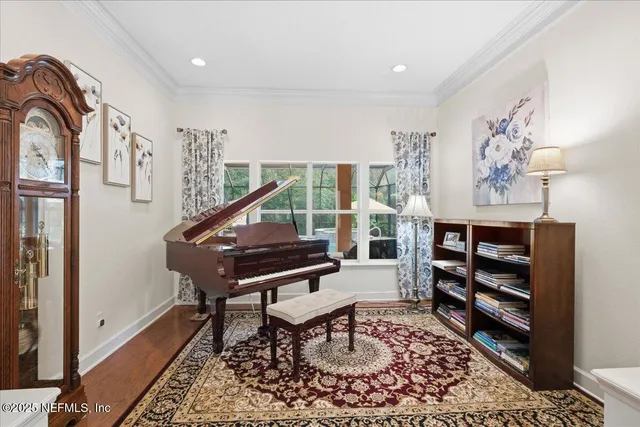 a kitchen with granite countertop a sink and a refrigerator