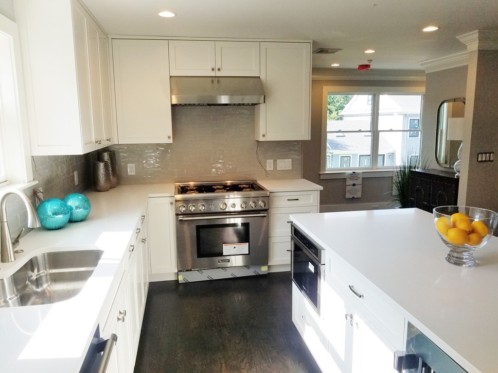 1525 Beacon Street, Unit 3 Newton, MA 02468 - Photo 11 of 21 a kitchen with a stove a sink and a refrigerator