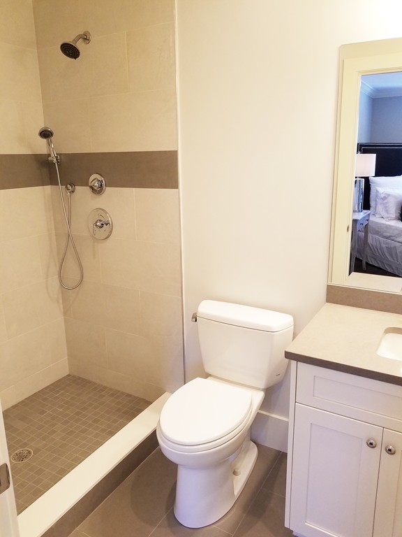 1525 Beacon Street, Unit 3 Newton, MA 02468 - Photo 15 of 21 a white toilet sitting next to a bathroom sink