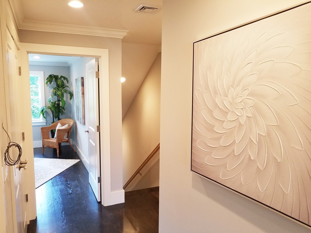 1525 Beacon Street, Unit 3 Newton, MA 02468 - Photo 17 of 21 a view of a hallway with wooden floor and a living room