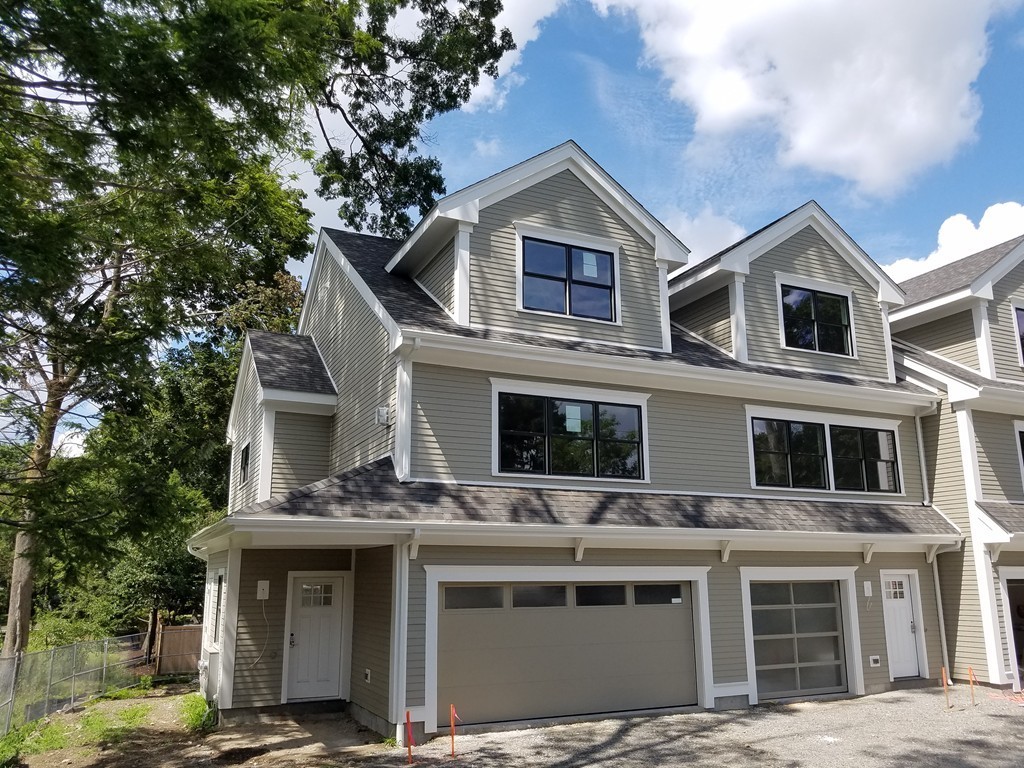 1525 Beacon Street, Unit 3 Newton, MA 02468 - Photo 21 of 21 a front view of a house with a garage