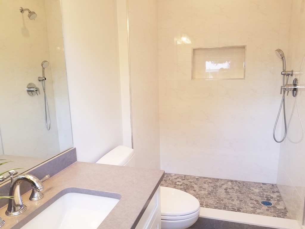 1525 Beacon Street, Unit 3 Newton, MA 02468 - Photo 3 of 21 a bathroom with a granite countertop sink toilet and shower