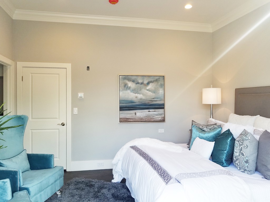 1525 Beacon Street, Unit 3 Newton, MA 02468 - Photo 6 of 21 a bedroom with a bed and a couch