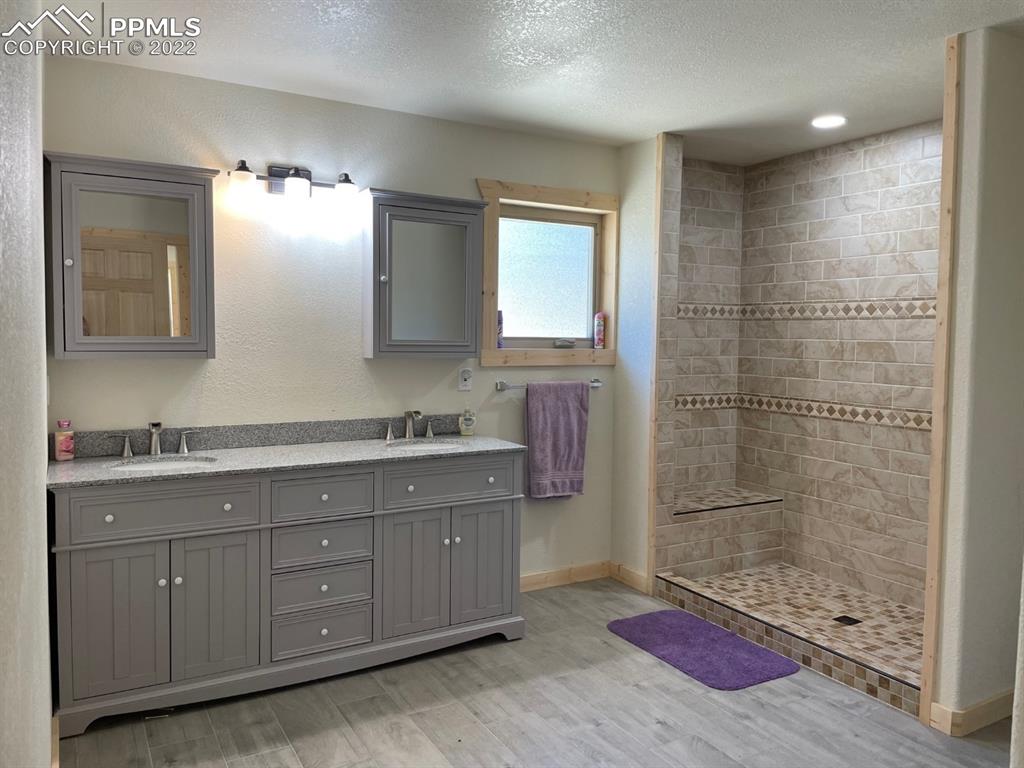 188 Keepsake Loop Westcliffe, CO 81252 - Photo 14 of 37 a bathroom with a sink a toilet and shower