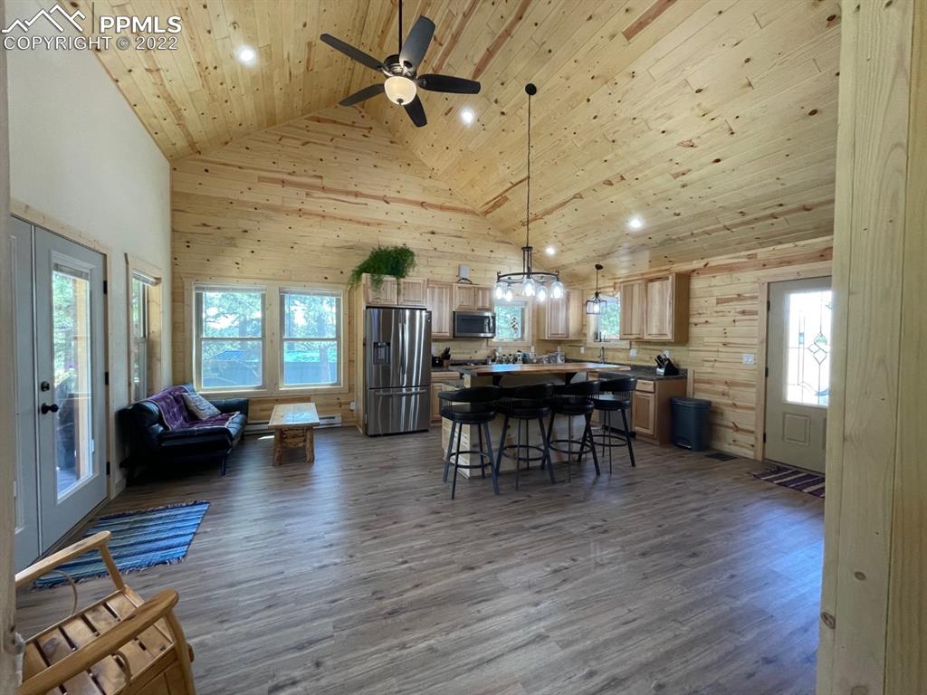 188 Keepsake Loop Westcliffe, CO 81252 - Photo 19 of 37 a view of a dining room with furniture window and wooden floor