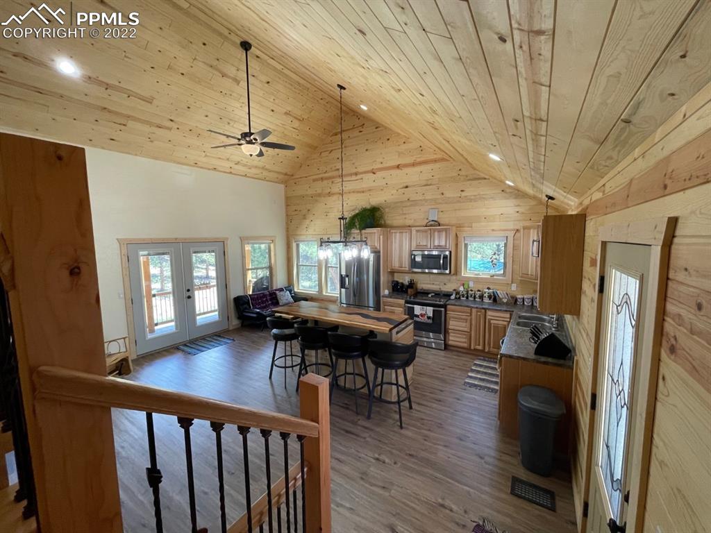 188 Keepsake Loop Westcliffe, CO 81252 - Photo 20 of 37 a view of a dining room with furniture window and wooden floor