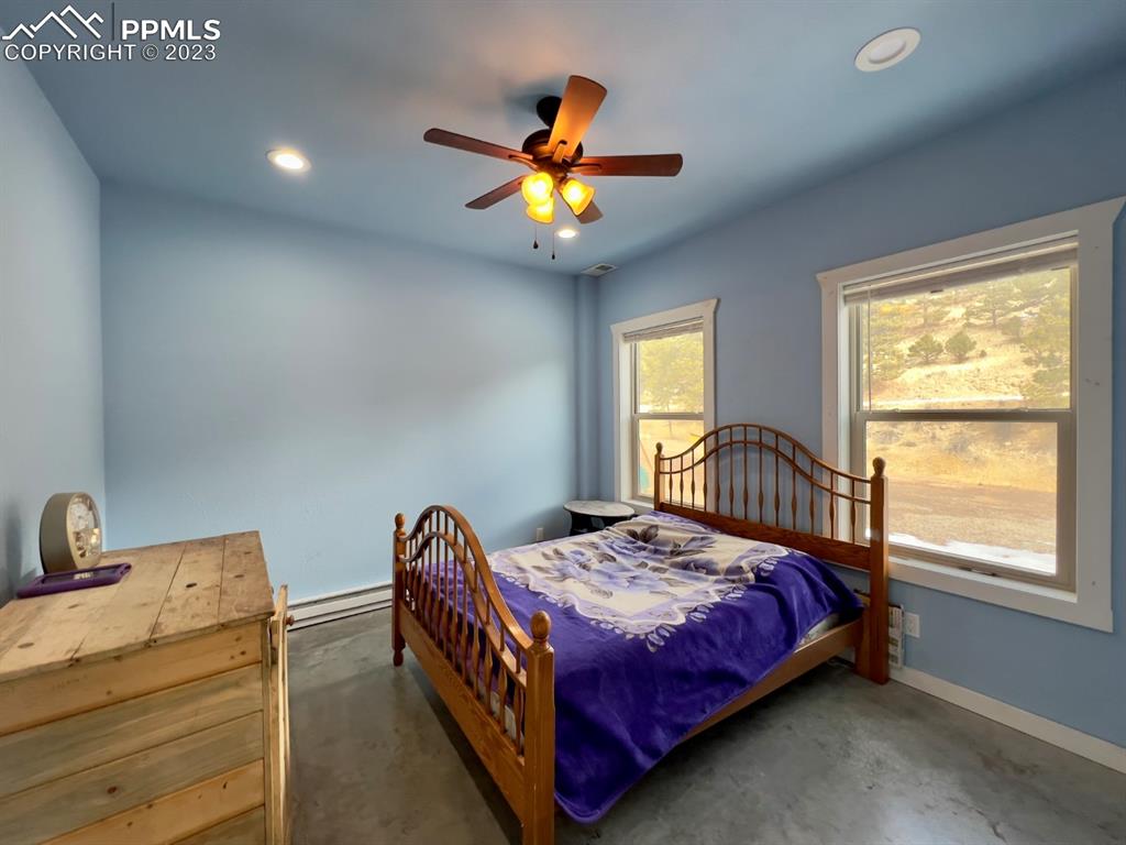 188 Keepsake Loop Westcliffe, CO 81252 - Photo 30 of 37 a bedroom with a bed and window