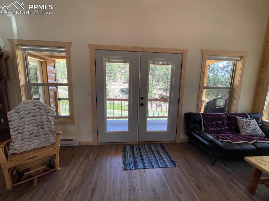 188 Keepsake Loop Westcliffe, CO 81252 - Photo 4 of 37 a living room with furniture and a wooden floor