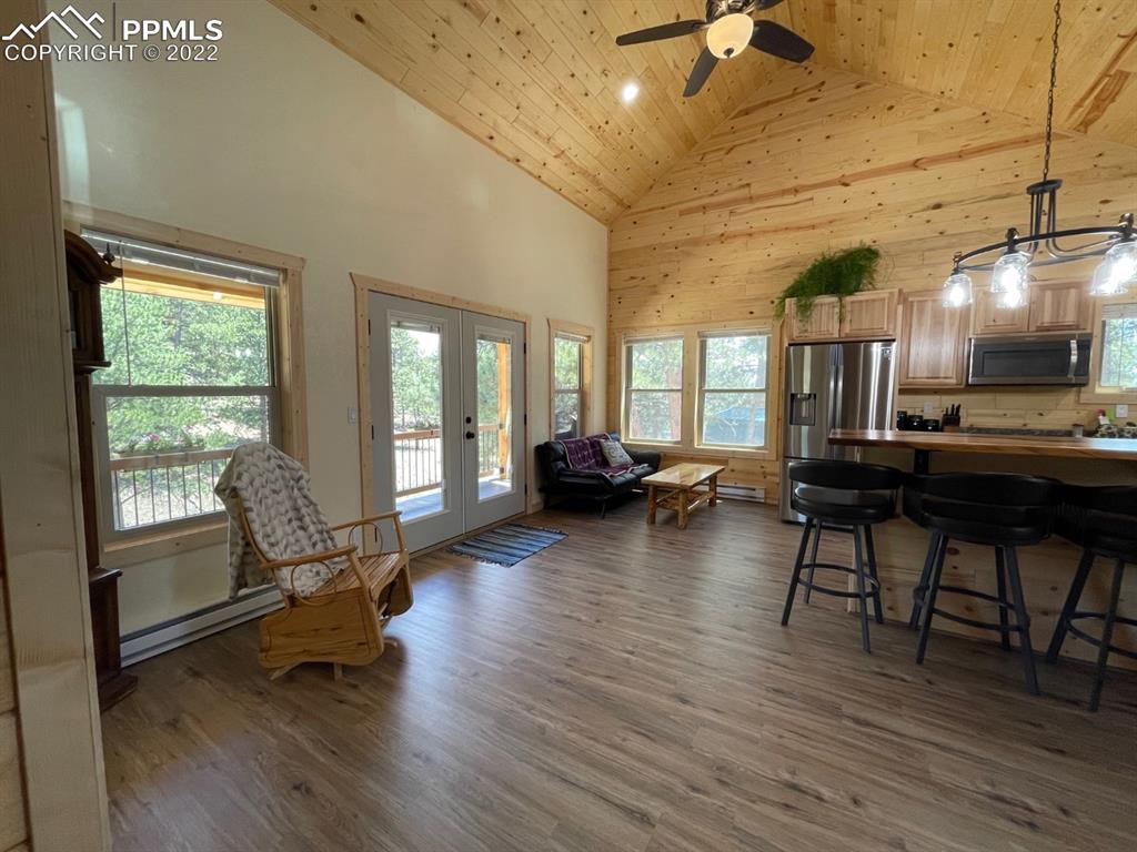 188 Keepsake Loop Westcliffe, CO 81252 - Photo 6 of 37 a living room with furniture and a wooden floor