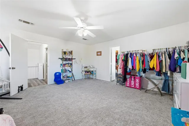 a bathroom with a tub sink double vanity granite and shower