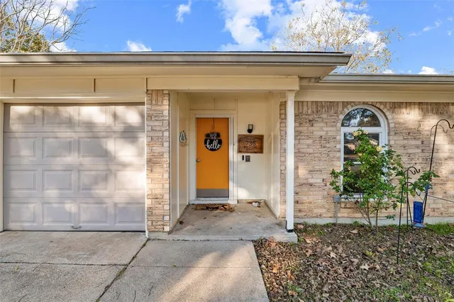 a front view of a house with a glass windows