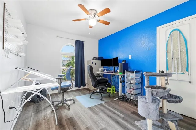 a view of room with window and ceiling fan
