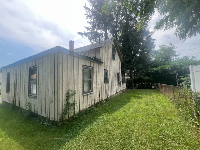 a backyard of a house with seating space