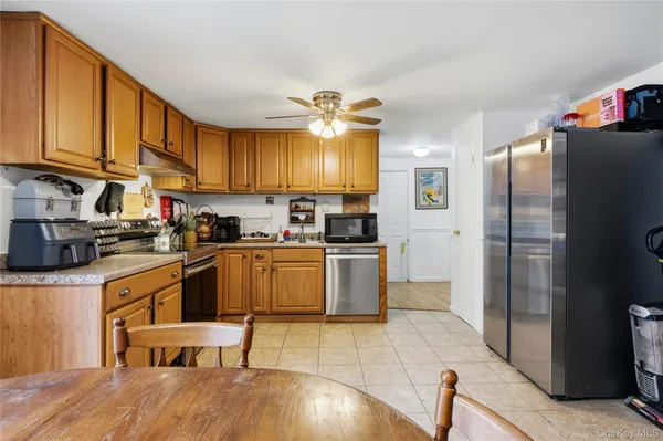 a kitchen with a sink cabinets and stainless steel appliances