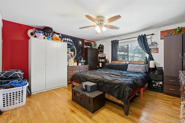 a bedroom with bed and window