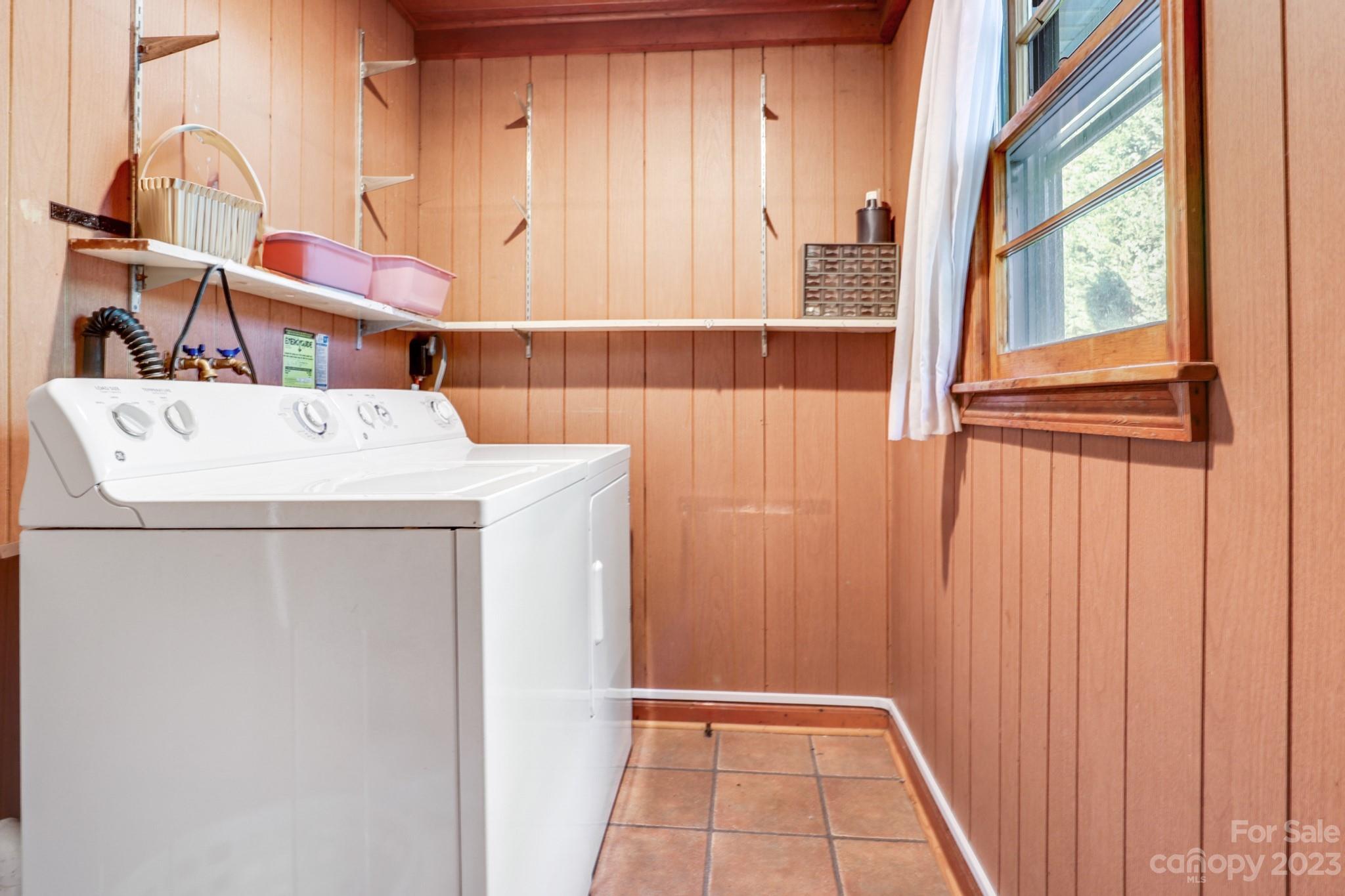 56 Thompson Cove Road, Unit 8 Clyde, NC 28721 - Photo 12 of 21 a utility room with dryer and washer
