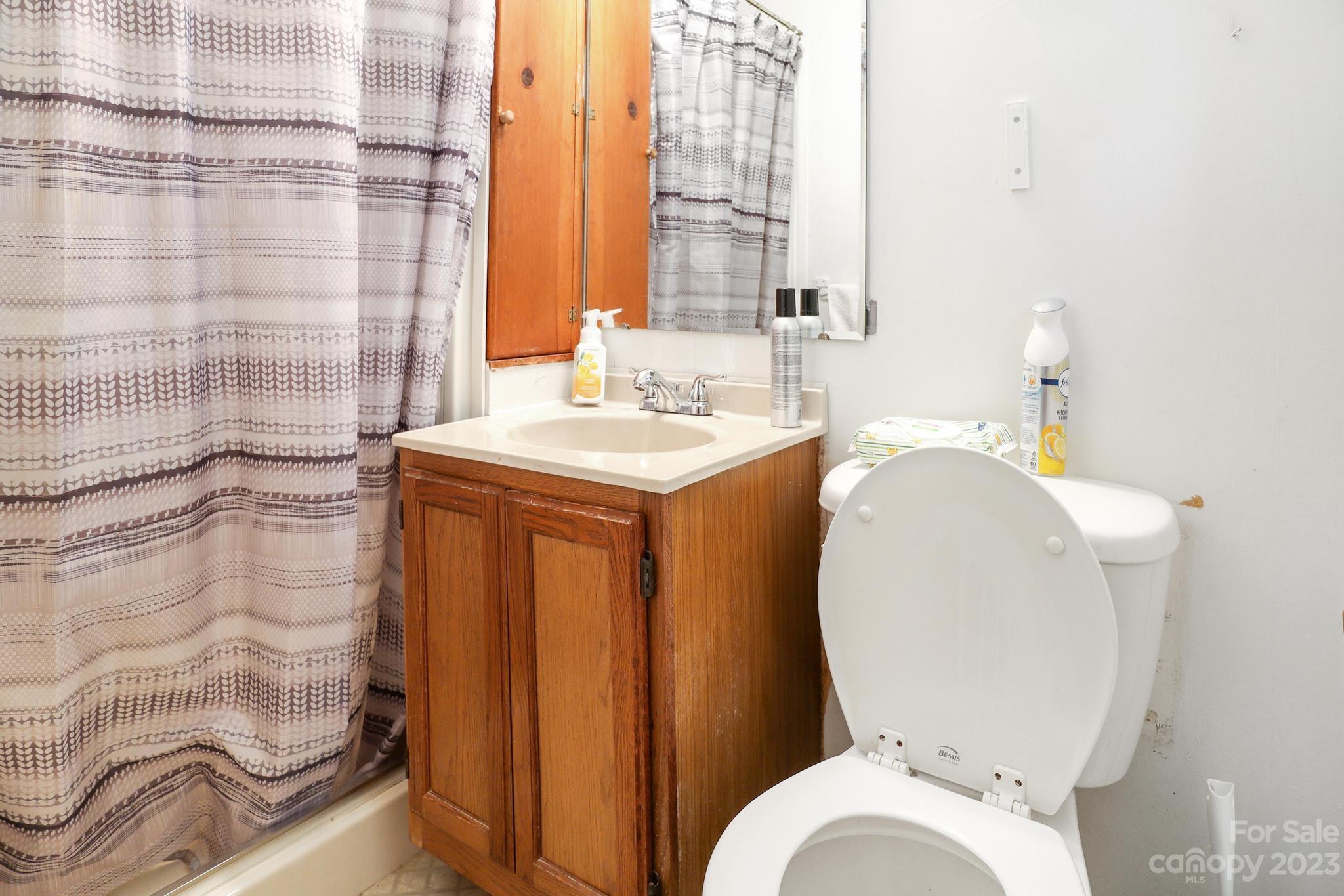 56 Thompson Cove Road, Unit 8 Clyde, NC 28721 - Photo 20 of 21 a bathroom with a sink toilet and shower