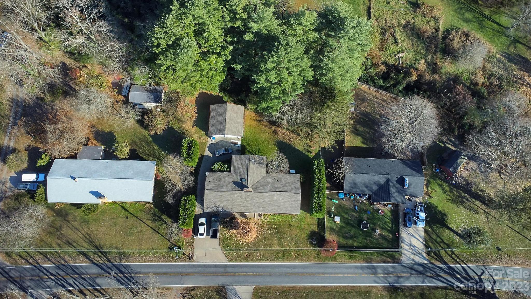 56 Thompson Cove Road, Unit 8 Clyde, NC 28721 - Photo 3 of 21 an aerial view of a house with outdoor space