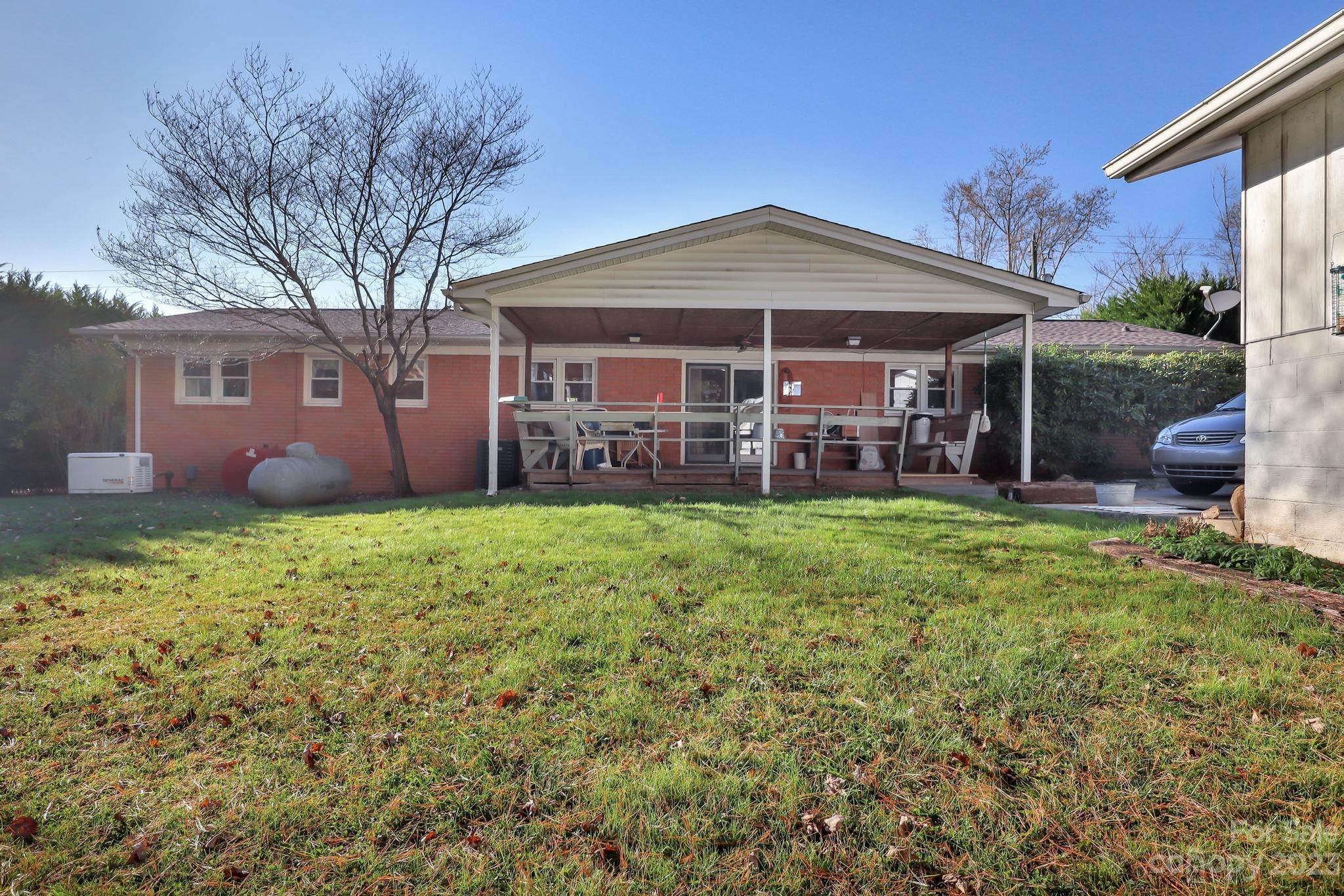 56 Thompson Cove Road, Unit 8 Clyde, NC 28721 - Photo 5 of 21 front view of a house with a yard