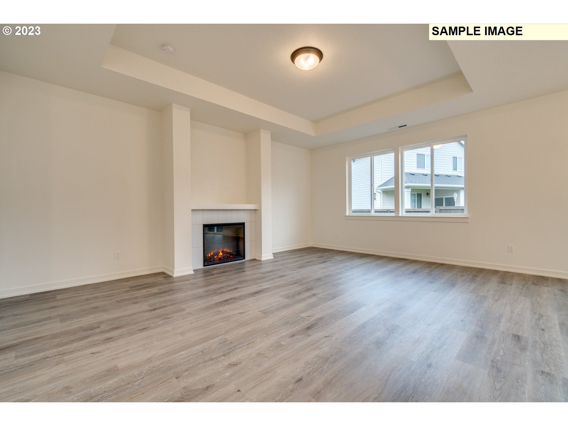 3810 South 44th Avenue Ridgefield, WA 98642 - Photo 7 of 14 a view of an empty room with wooden floor and a window