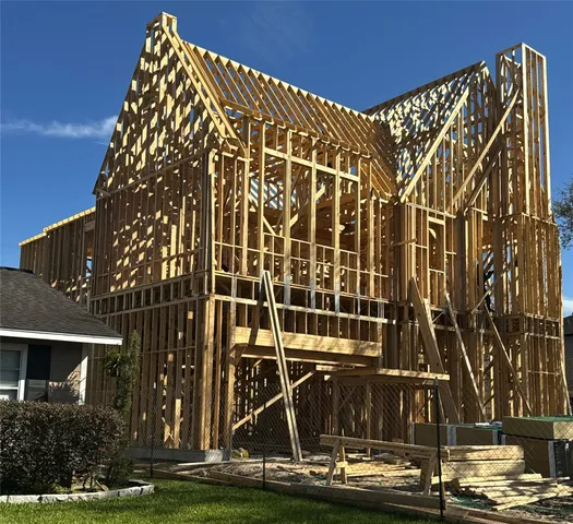 a large kitchen with a table and chairs