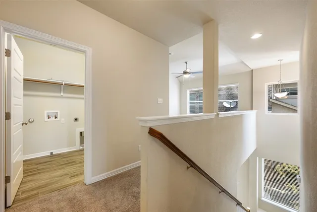 a view of kitchen with windows and refrigerator