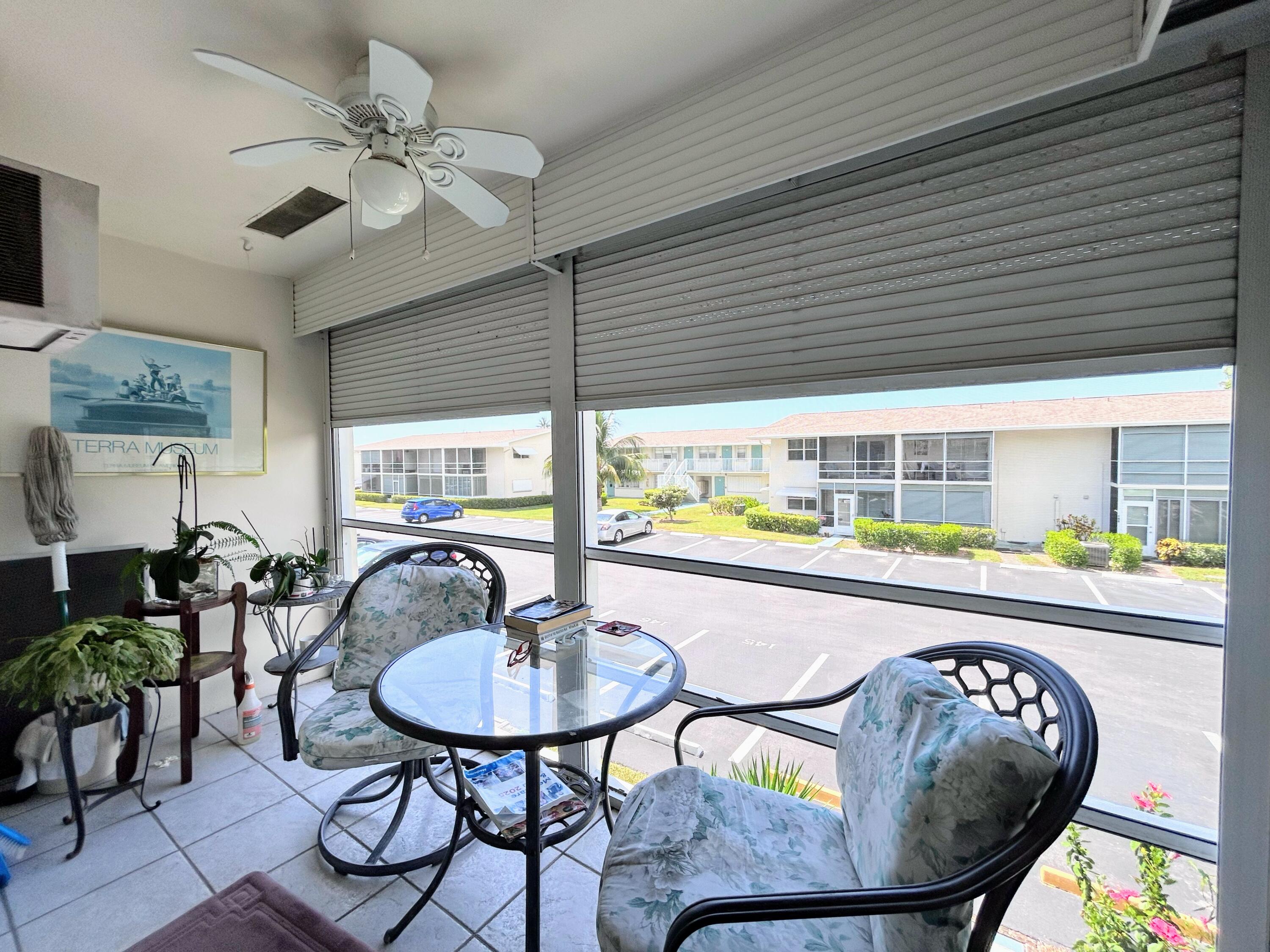 340 Horizon West, Unit 203 Boynton Beach, FL 33435 - Photo 15 of 45 a living room with furniture and a table