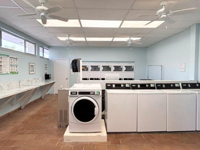 340 Horizon West, Unit 203 Boynton Beach, FL 33435 - Photo 23 of 45 a utility room with dryer and washer