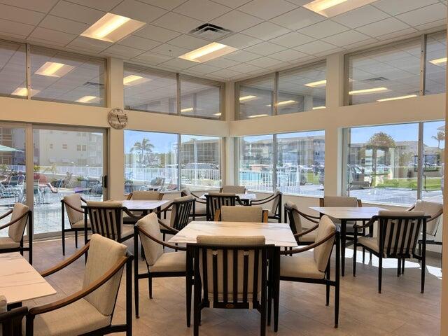 340 Horizon West, Unit 203 Boynton Beach, FL 33435 - Photo 31 of 45 a view of a dining room with furniture window and outside view