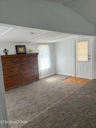 a view of empty room with windows