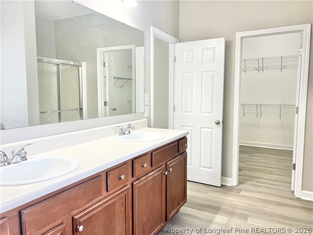 1523 Rough Rider Lane Parkton, NC 28371 - Photo 28 of 42 a bathroom with a sink double vanity and a mirror