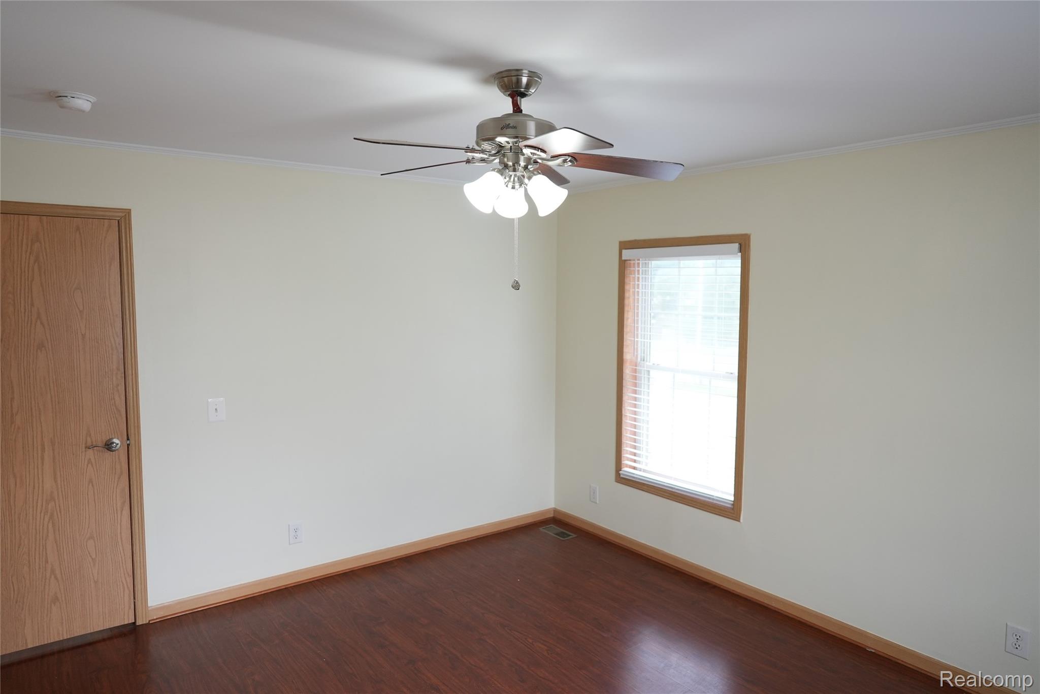 2018 John R Road Troy, MI 48083 - Photo 48 of 57 Wood-finish flooring with coordinating wood trim and door
