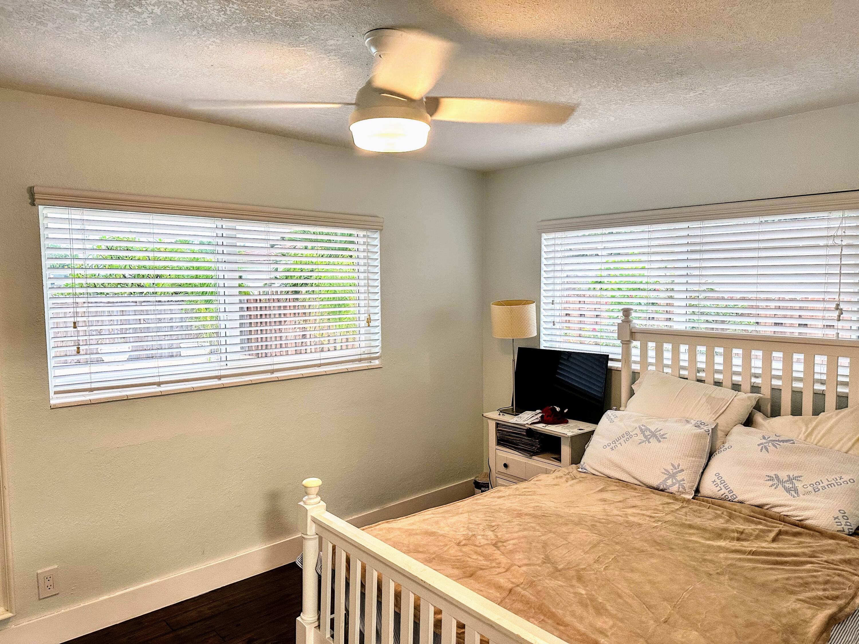 469 Northeast 30th Street Boca Raton, FL 33431 - Photo 14 of 24 a bedroom with a bed and a window