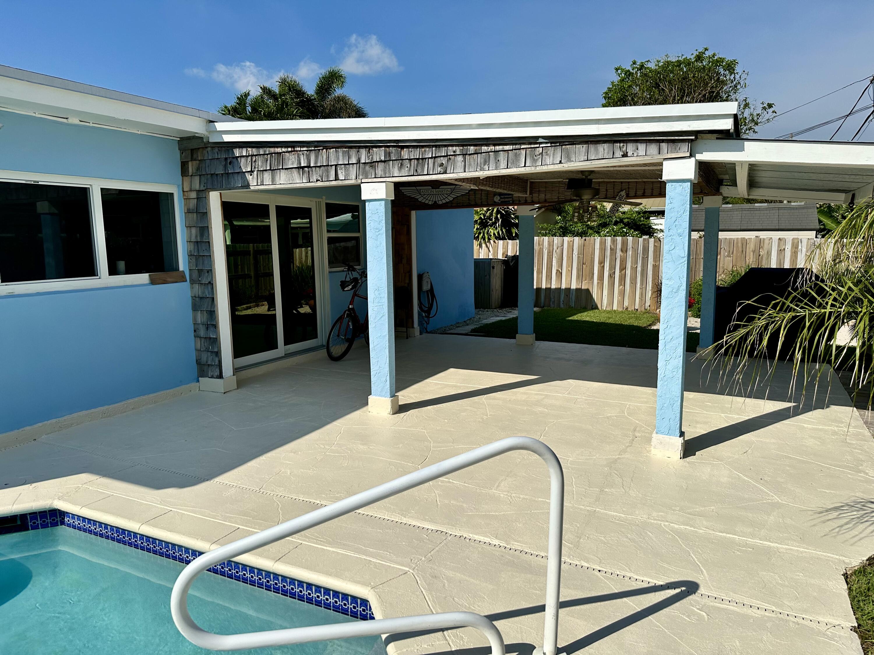 469 Northeast 30th Street Boca Raton, FL 33431 - Photo 23 of 24 a view of a patio with table and chairs