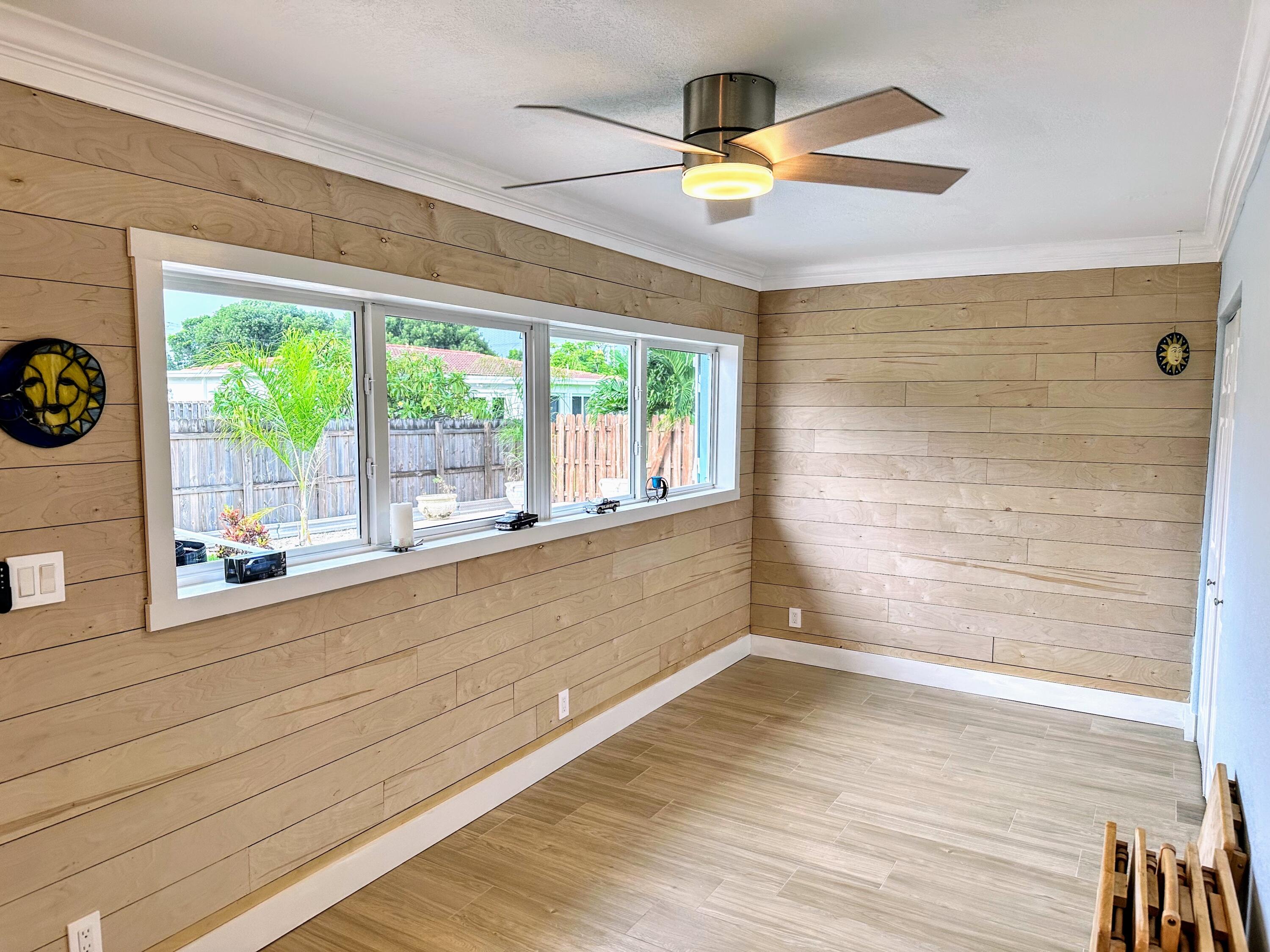 469 Northeast 30th Street Boca Raton, FL 33431 - Photo 10 of 24 a view of empty room with wooden floor and fan