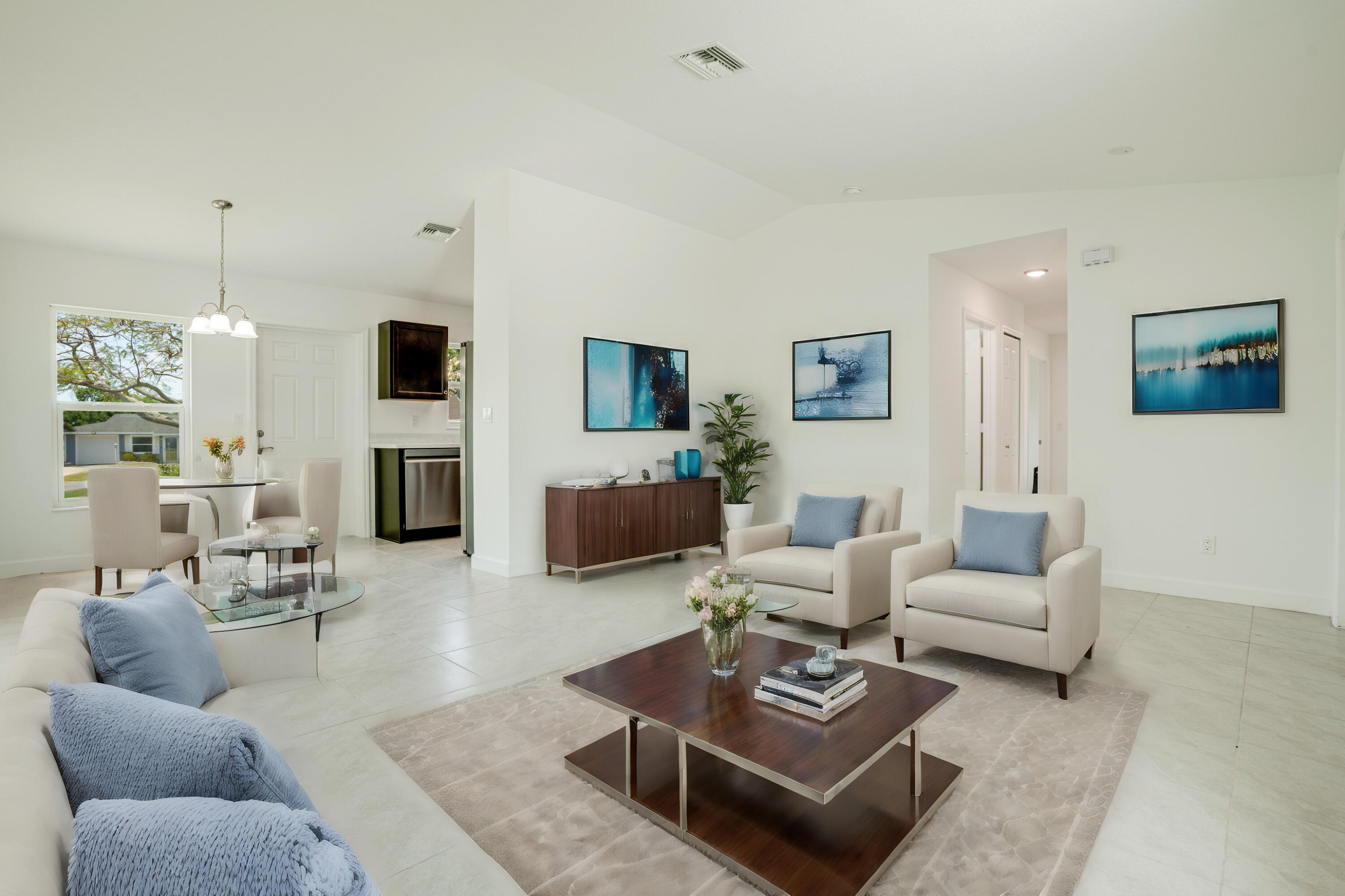 5264 Southeast 43rd Street Okeechobee, FL 34974 - Photo 2 of 16 a living room with furniture and a flat screen tv