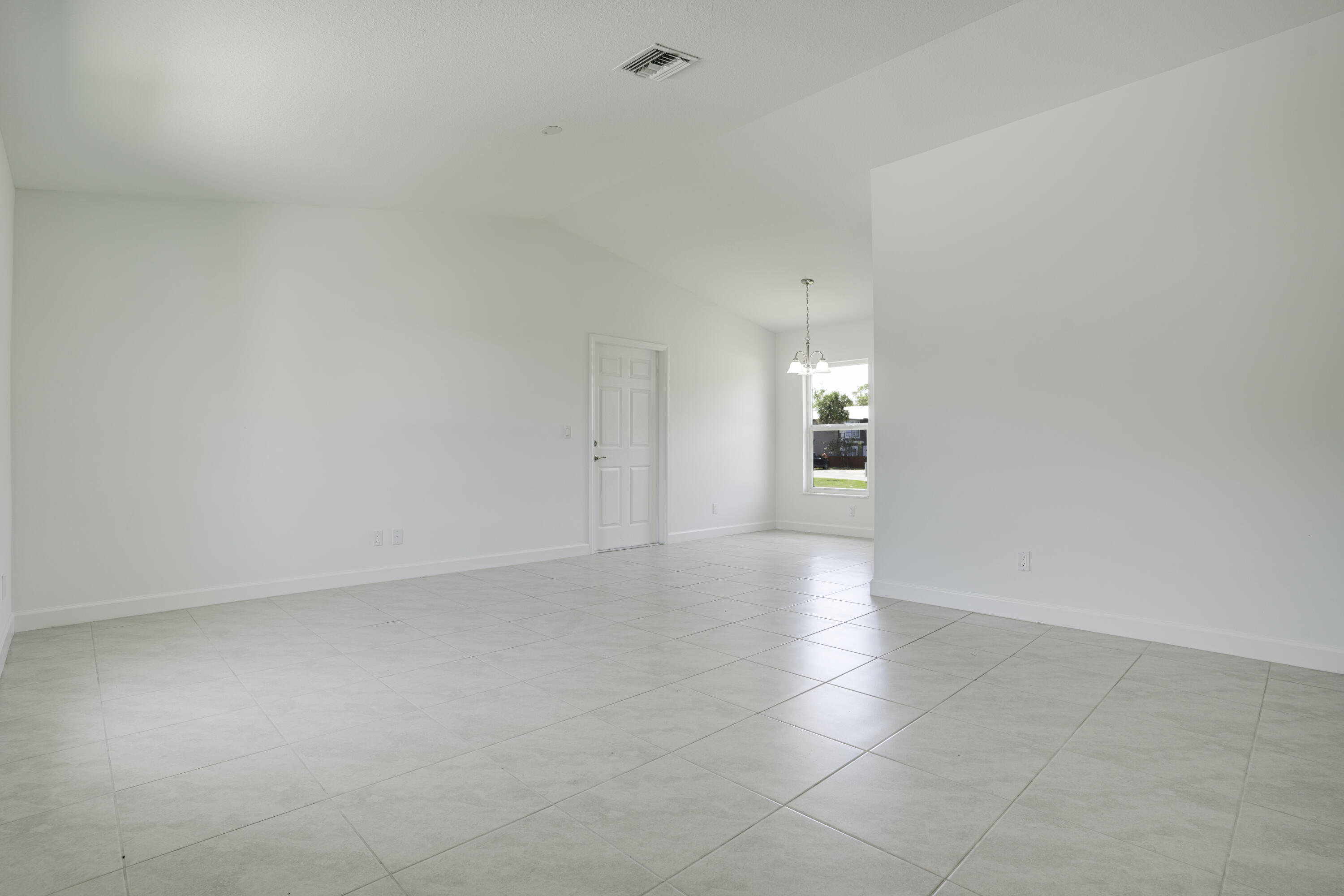 5264 Southeast 43rd Street Okeechobee, FL 34974 - Photo 4 of 16 a view of an empty room and a window