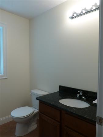 92 Kendall Road Holden, MA 01520 - Photo 9 of 12 a bathroom with a granite countertop toilet and a sink
