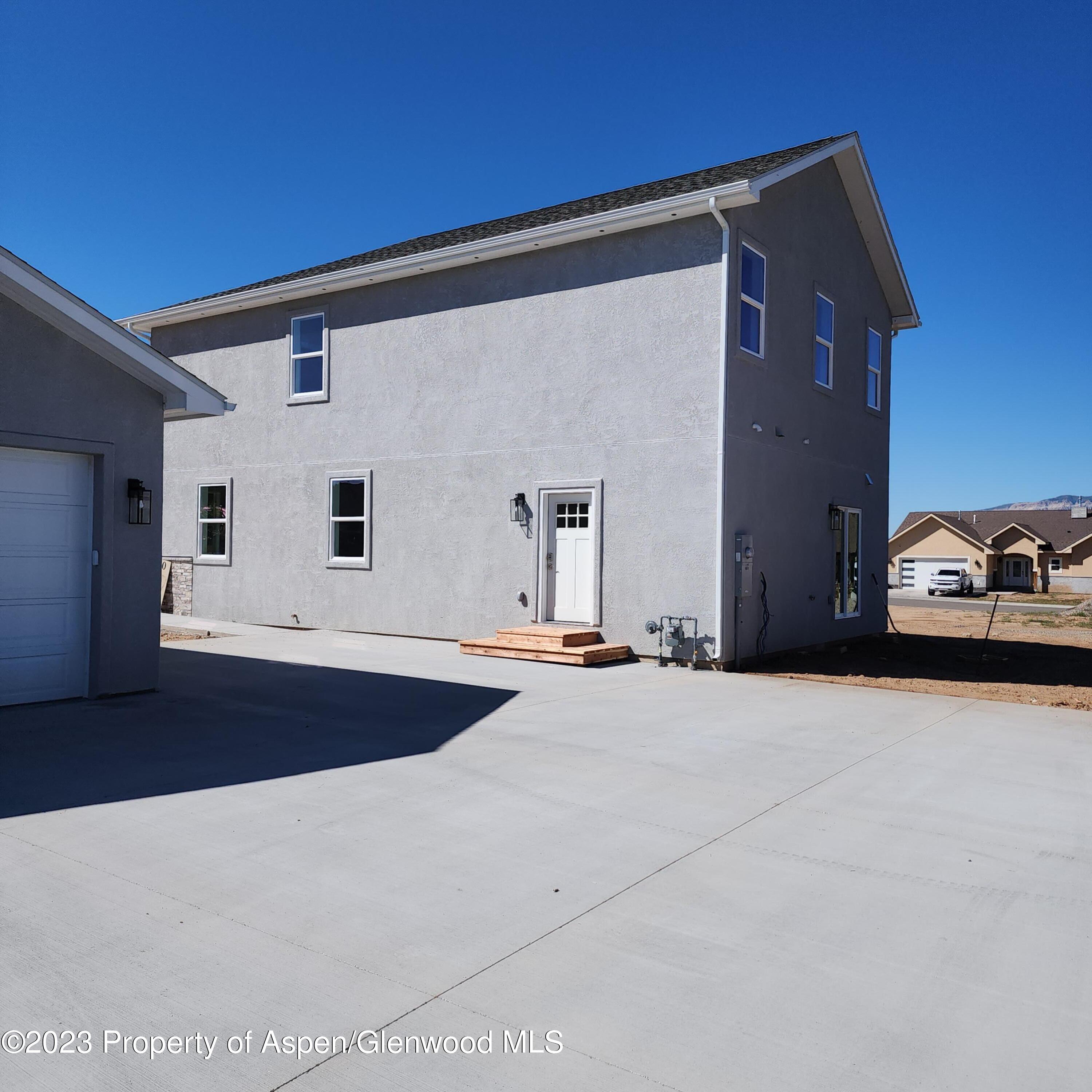 890 East 16th Street Rifle, CO 81650 - Photo 17 of 17 a front view of a house with parking space