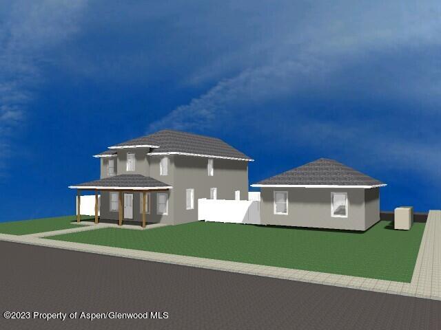 890 East 16th Street Rifle, CO 81650 - Photo 4 of 17 a front view of a house with a yard and garage