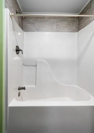 a bathroom with a white bath tub