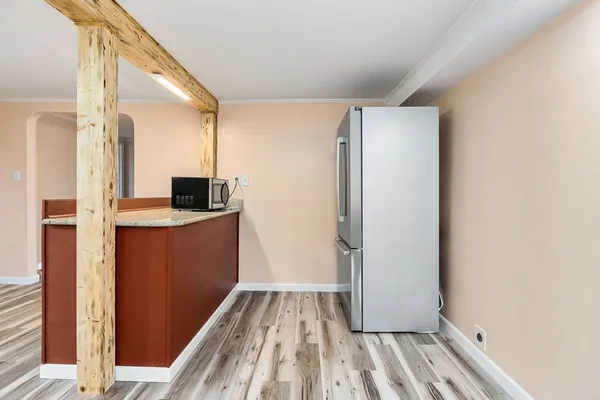 a view of kitchen with wooden floor