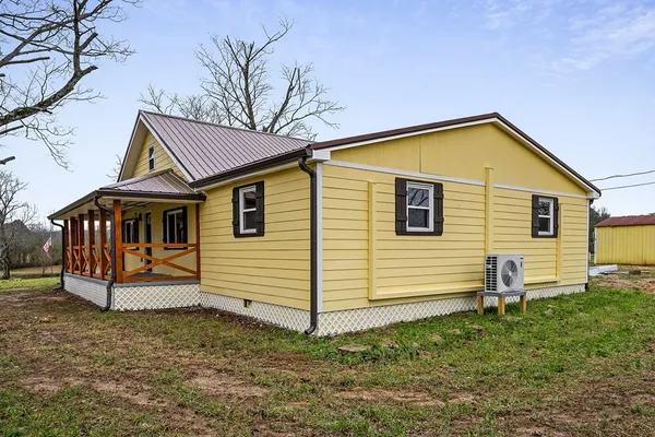 a front view of a house with yard
